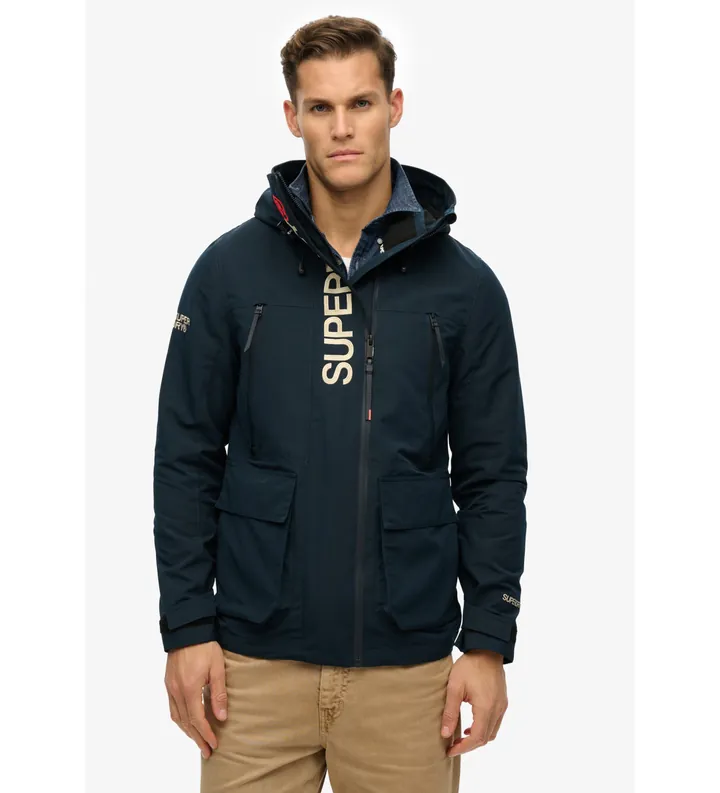 Superdry para hombre. M5012104A Chaqueta cortavientos con capucha y bordado Ultimate marino (L), Casual, Poliéster