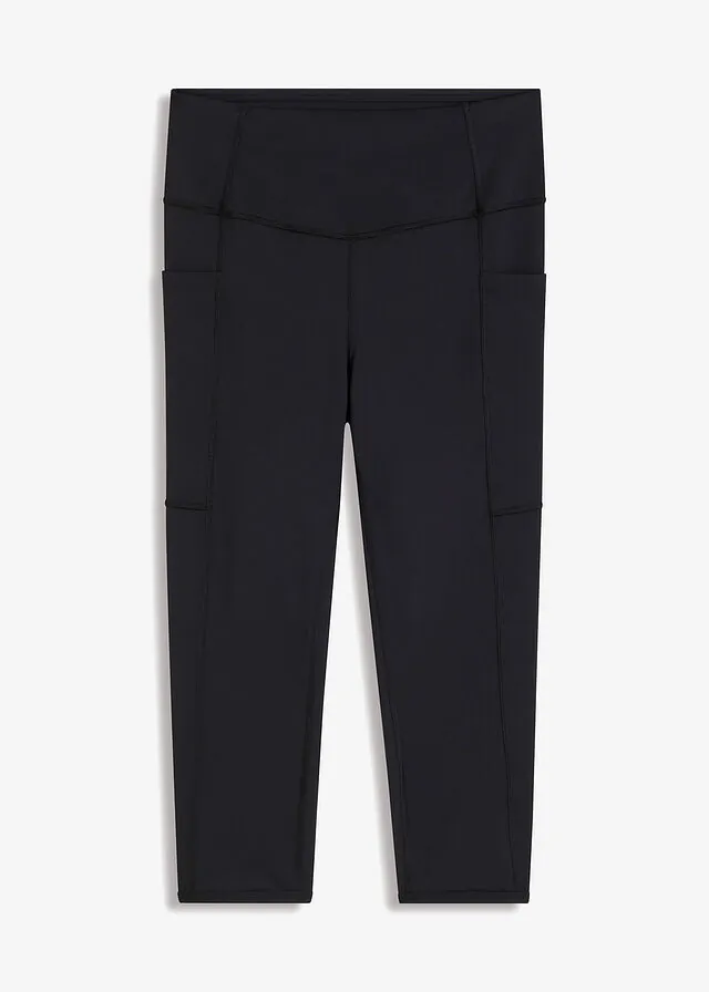 Cómodos leggings deportivos capri con bolsillo para móvil y material de secado rápido