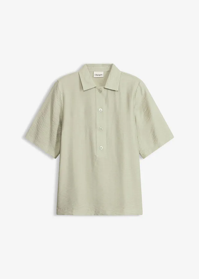 Blusa tipo túnica ligeramente transparente